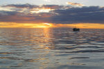 Sunset with Stormy, my uncle's boat, in the foreground.